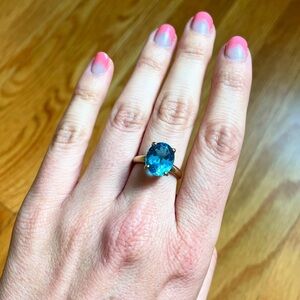 9k blue topaz solitaire